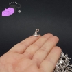 10 charms with silver tone witch's hat