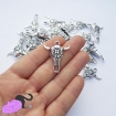 5 charms with cow skull
