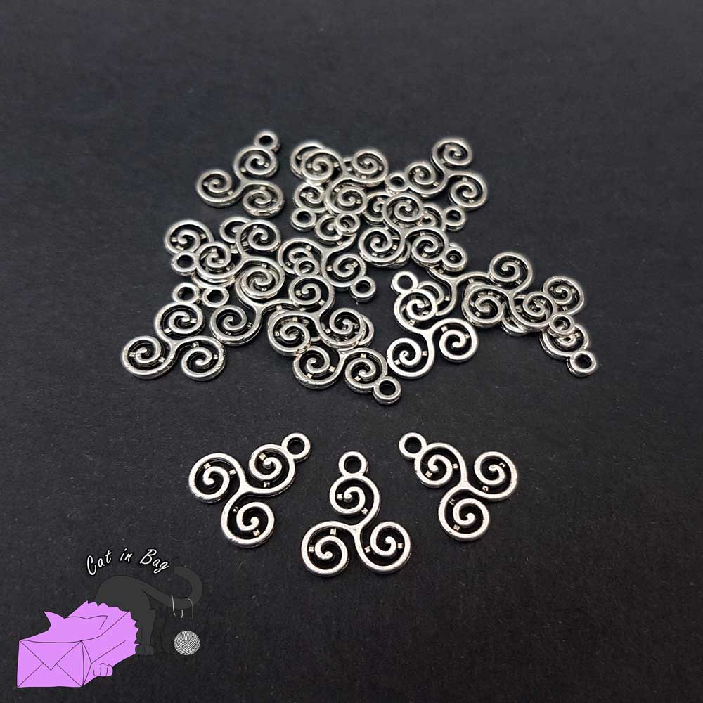 10 charms with Triskel silver tone