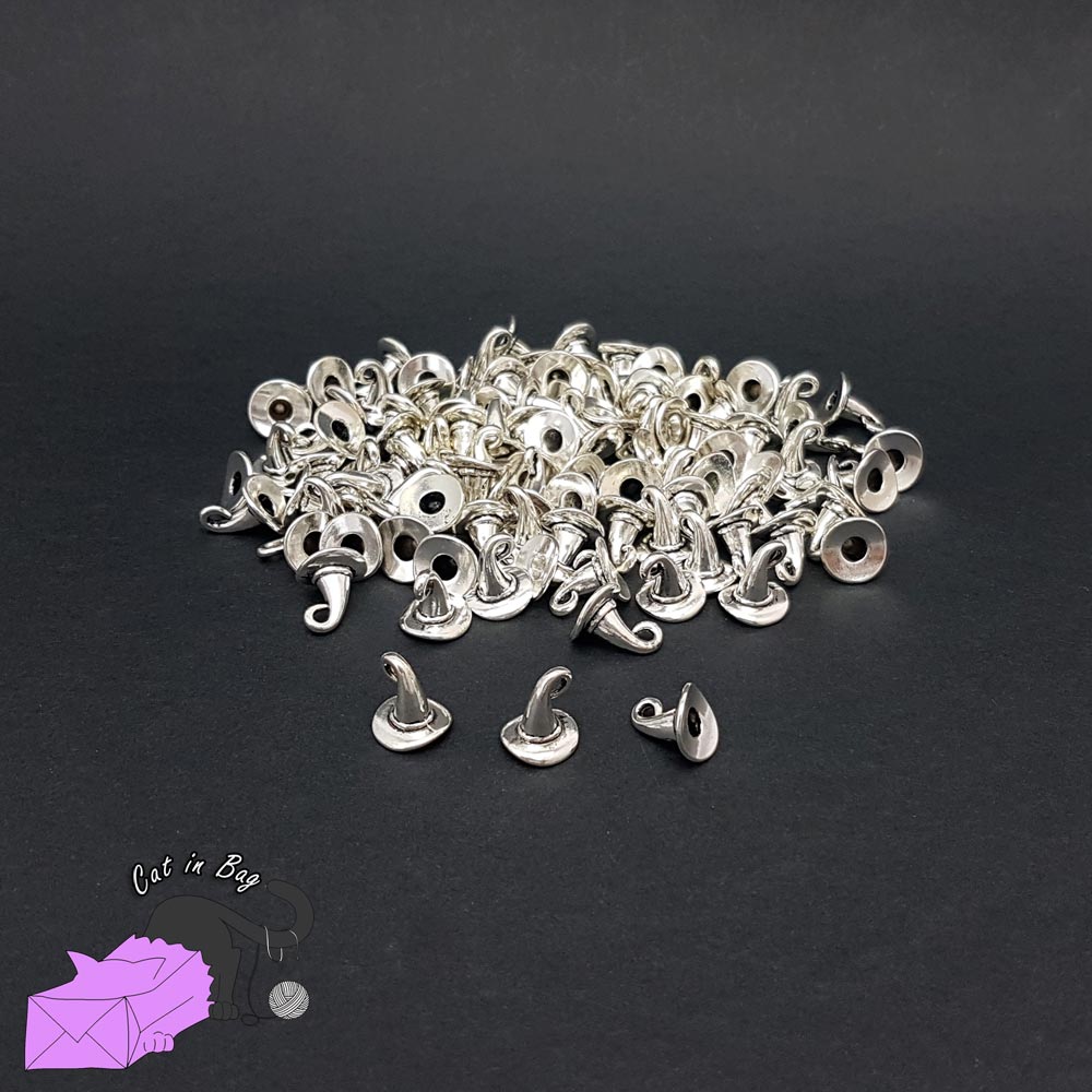 10 charms with silver tone witch's hat