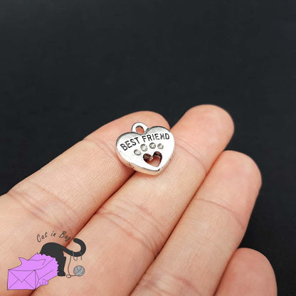 5 heart charms with paw and the words "best friend"