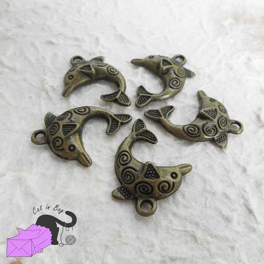 5 charms with dolphin and spirals