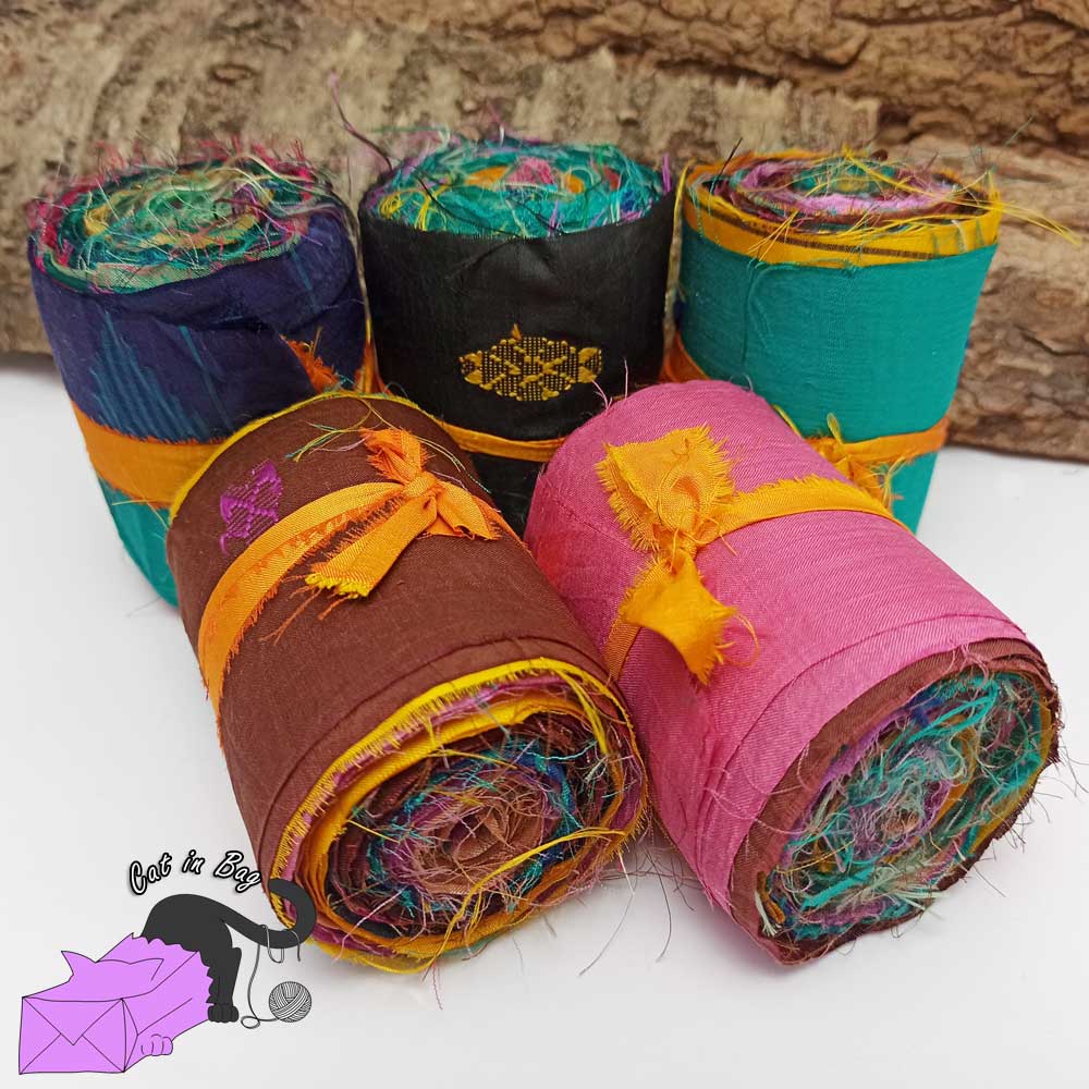 Roll of ribbons of sari silk fabric